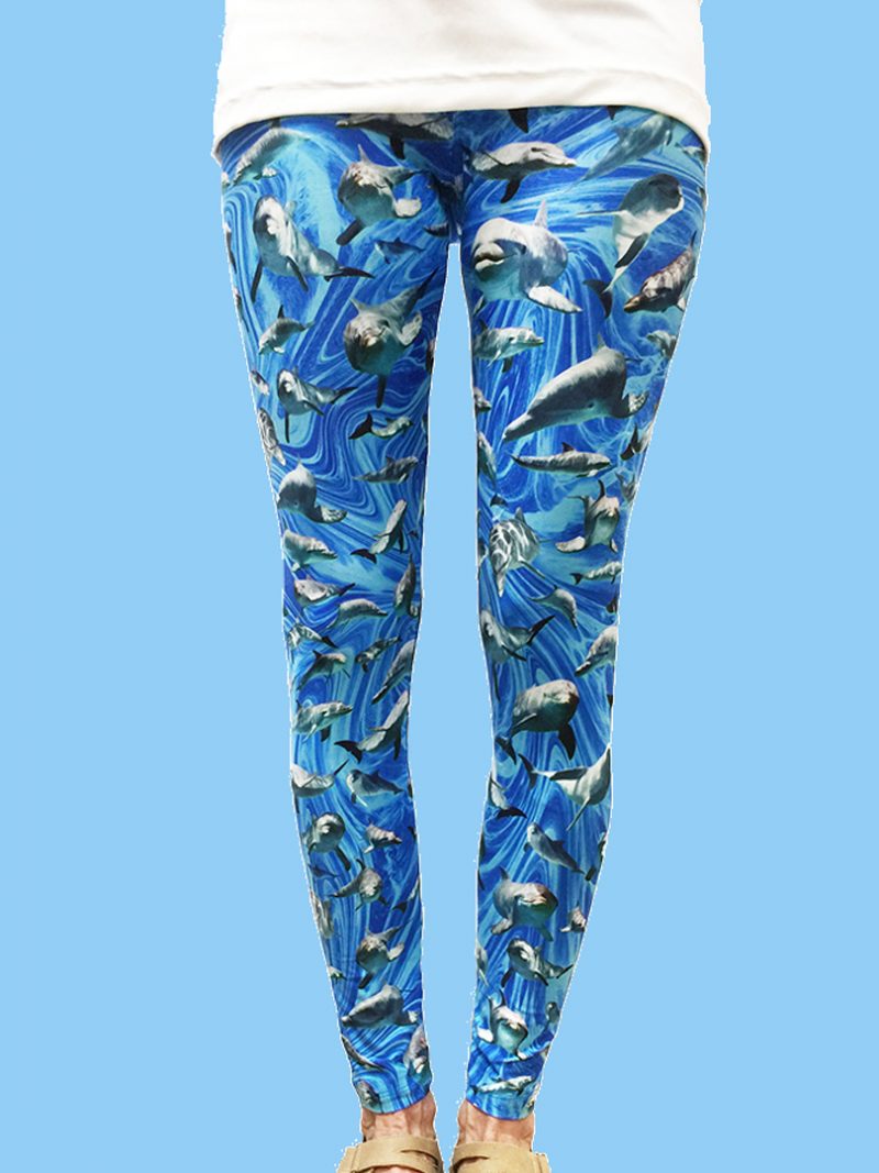 ladies leggings with a blue ocean swirl background with numerous dolphin photos